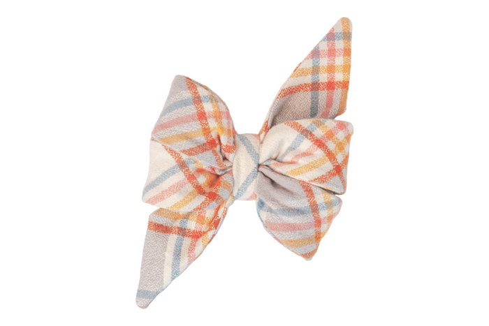 A large, flannel belle bow with a pastel plaid pattern. The feminine belle bow features layered loops and pointed tails, with intersecting stripes. The cinched  center gives the belle bow a full, sculpted look.
