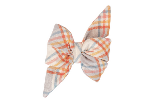 A large, flannel belle bow with a pastel plaid pattern. The feminine belle bow features layered loops and pointed tails, with intersecting stripes. The cinched  center gives the belle bow a full, sculpted look.