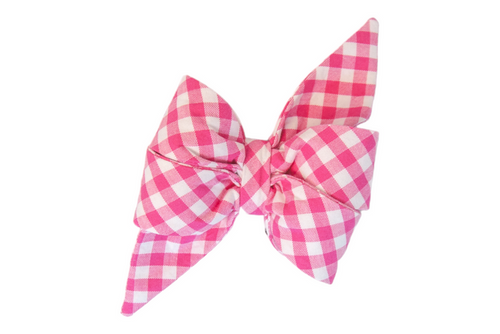Vibrant fuchsia plaid dog belle bow with a white check pattern, crafted into a feminine voluminous double-layered bow. Long, sharply tapered ends extend from the knot, adding a playful yet polished flair.