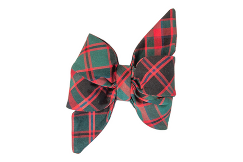 A festive fabric belle bow in a classic red  plaid pattern, featuring pointed tails and crisp folds. The belle bow is structured and symmetrical, perfect for attaching to a dog collar or adding a cheerful touch to holiday outfits.