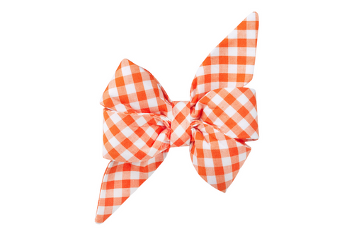 Bright orange and white plaid dog belle bow with exaggerated floppy tails and a full, layered center knot. The oversized feminine design attaches securely to a collar for a fun, festive look—perfect for pups who like making grand entrances at the dog park.