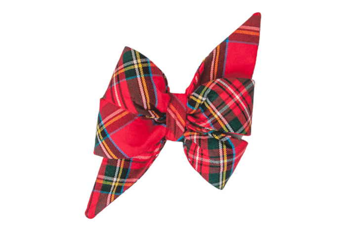 Classic holiday belle bow in bold red plaid with accents of festive hues, shaped with structured double loops and long pointed tails—perfect for pups with timeless seasonal style.
